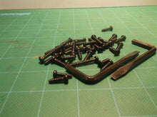 Assorted Hardware Off A Ryobi P546 18 Volt Chain Saw