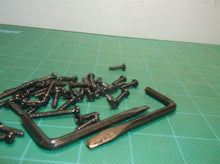 Assorted Hardware Off A Ryobi P546 18 Volt Chain Saw