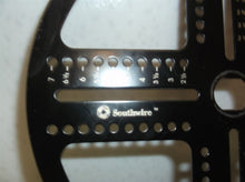 Metal Disc With Measurements Off A Southwire Can Light Hole Saw