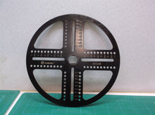 Metal Disc With Measurements Off A Southwire Can Light Hole Saw