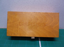 Assorted router bits in craftsman wooden storage box