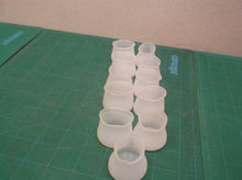 lot of 11 Rubber chair/table leg floor protections