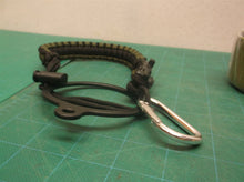 Green & black survival bracelet with cup