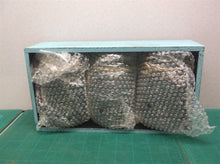 3 decorative mason jars in light blue wooden case
