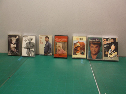 (7) cassette tapes Country genre Black, Parton, Twitty, Tuttle, Cline & Cyrus