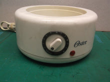 Heating base unit from a Oster Double Tiered Food Steamer 5 Qt White CKSTSTMD5