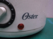 Heating base unit from a Oster Double Tiered Food Steamer 5 Qt White CKSTSTMD5