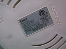Heating base unit from a Oster Double Tiered Food Steamer 5 Qt White CKSTSTMD5