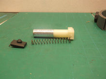 Plunger assembly from a DeWALT dwht75021 5-in-1 Multi-Tacker and Brad Nailer