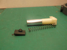 Plunger assembly from a DeWALT dwht75021 5-in-1 Multi-Tacker and Brad Nailer