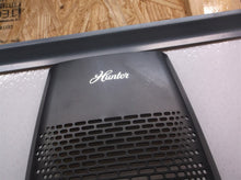 Black front grill off a Hunter Tall Tower Air Purifier hp600