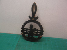 vintage orange metal trivet lady holding flowers