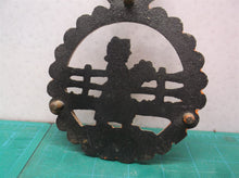 vintage orange metal trivet lady holding flowers