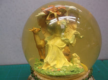 angle with animals musical snow globe. Plays "Waltz of the flowers"