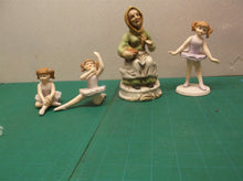 Lot of 4 porcelain figures