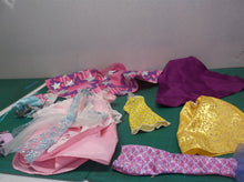 assorted bag of doll cloths