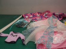 assorted bag of doll cloths