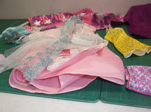 assorted bag of doll cloths
