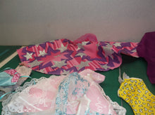 assorted bag of doll cloths