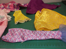 assorted bag of doll cloths