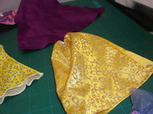 assorted bag of doll cloths