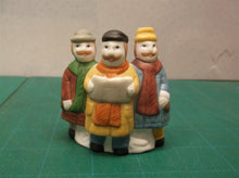 3 christmas carolers table decor
