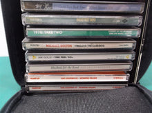 lot of 16 assorted cd's with case