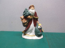 Santa figure with toys & tree