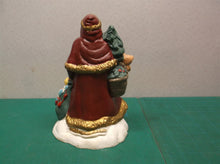Santa figure with toys & tree