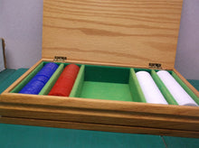 set of poker chips in wooden storage box