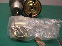 Defiant Nickel door knob with keys