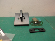 assorted black kwikset door knob parts