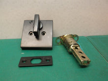 assorted black kwikset door knob parts