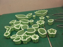 assorted lot of cookie cutters/chocolate molds