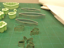 assorted lot of cookie cutters/chocolate molds