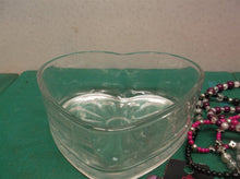 Glass heart shaped dish with costume jewelry