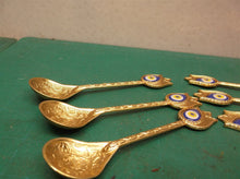 6 gold plated indian design spoons