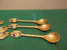 6 gold plated indian design spoons