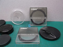 lot of camera lenses caps & filters
