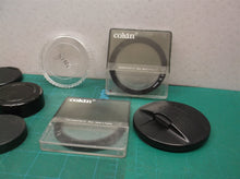 lot of camera lenses caps & filters