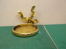 Gold in color candle holder