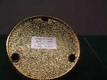 Gold in color candle holder
