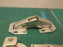 assorted cabinet hinge parts