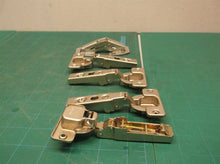 assorted cabinet hinge parts