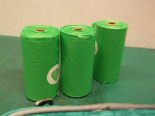 teal dog bags with poop bags for rope/leash