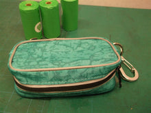 teal dog bags with poop bags for rope/leash