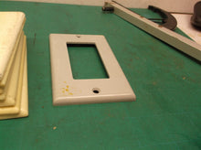 assorted plastic wall outlet & switch plates covers 1 gang
