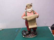 Santa Claus and his long list a table decoration