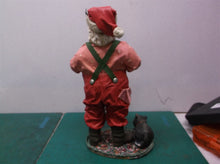 Santa Claus and his long list a table decoration