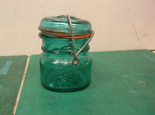 Vintage ball ideal canning jar with glass lid gasket is cracked